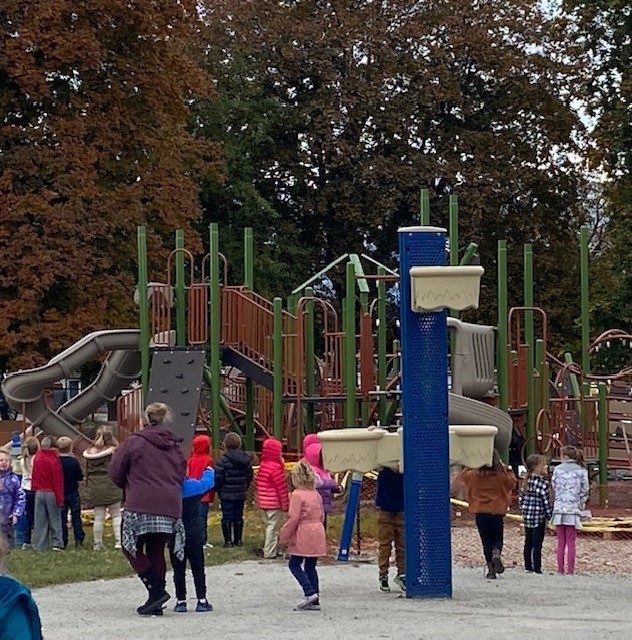 The anticipation of a new playground is almost more than the fence can hold! 