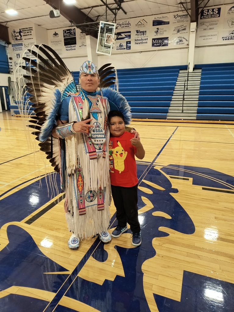 boy with native American dancer