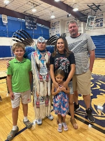 family with native American dancer