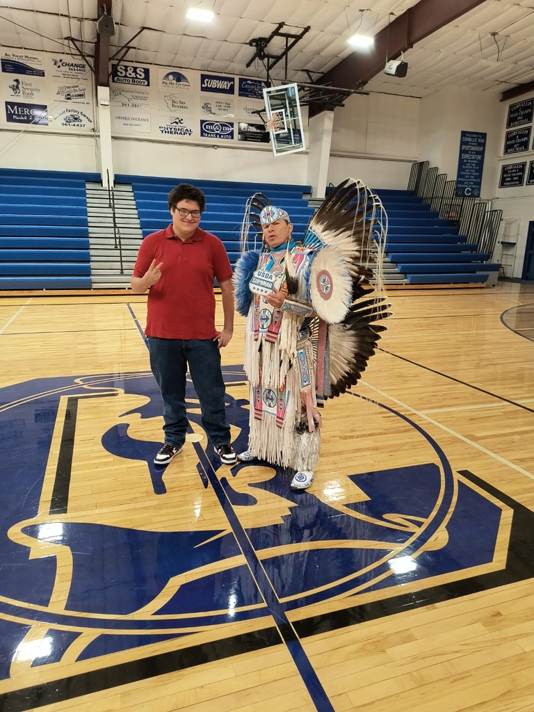 young man with native American dancer